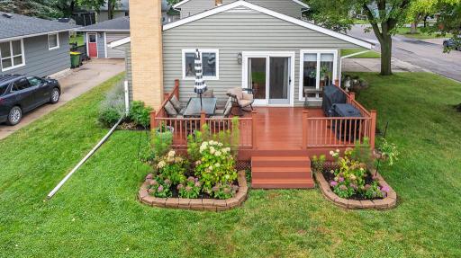Spacious maintenance free deck with gorgeous landscaped details!
