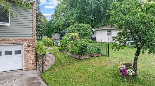 Enclosed fenced in area offers a space for your pets or kids to play