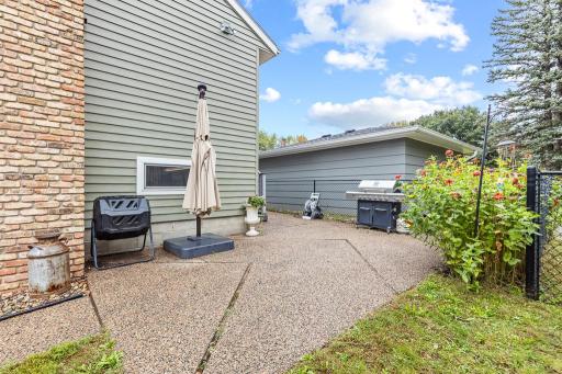 Perfect spot to put an additional set of patio furniture when grilling outside