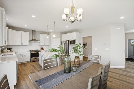 Dining Area - photo is of a previous inventory home. Inquire for more details and options.