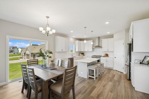 Dining Area - photo is of a previous inventory home. Inquire for more details and options.