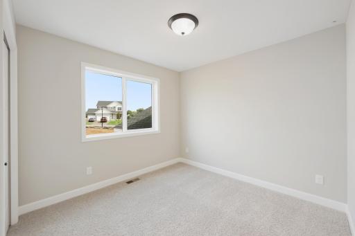 Second view of second bedroom on the main level.