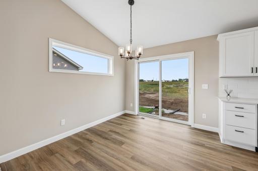 Dinette right off the living and kitchen space make gathering, entertaining and everyday living easy.