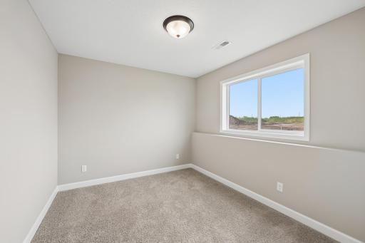 Second view of fourth bedroom located on lower level.