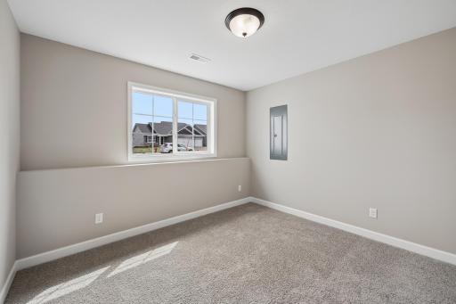 Second view of fifth bedroom located on lower level.