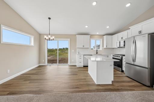 Kitchen and dinette space complete with LVP floor for easy maintenance.