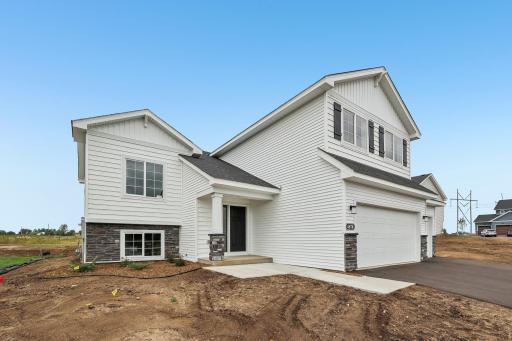 A unique floor plan and inviting exterior! *exterior sod and irrigation have been complete*