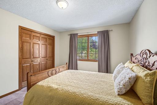 Second view of bedroom #2 showing its large closet and window that overlooks the front yard.