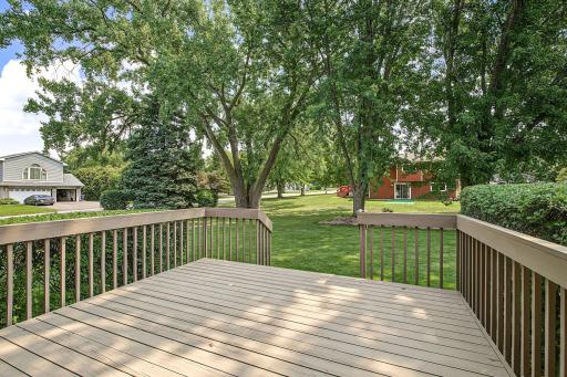 The lawn and landscaping have been neatly manicured by the current owners.