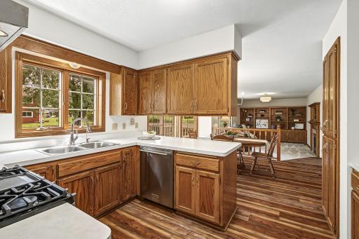 Rich wood laminate flooring flows throughout much of the main level for easy maintenance.