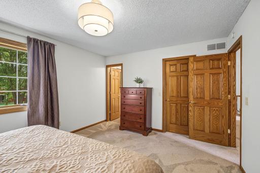 Second view of the primary suite showing the high quality six panel doors that you will find throughout this home.