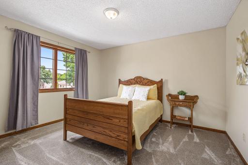 Bedroom #2 is spacious and has plenty of wall space for furniture placement and art.