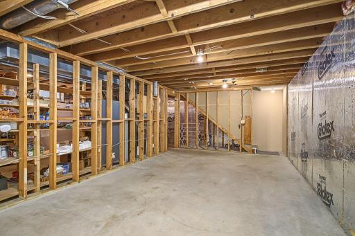 The unfinished lower level has a 20AMP electrical outlet and the gun safe is a negotiable item.