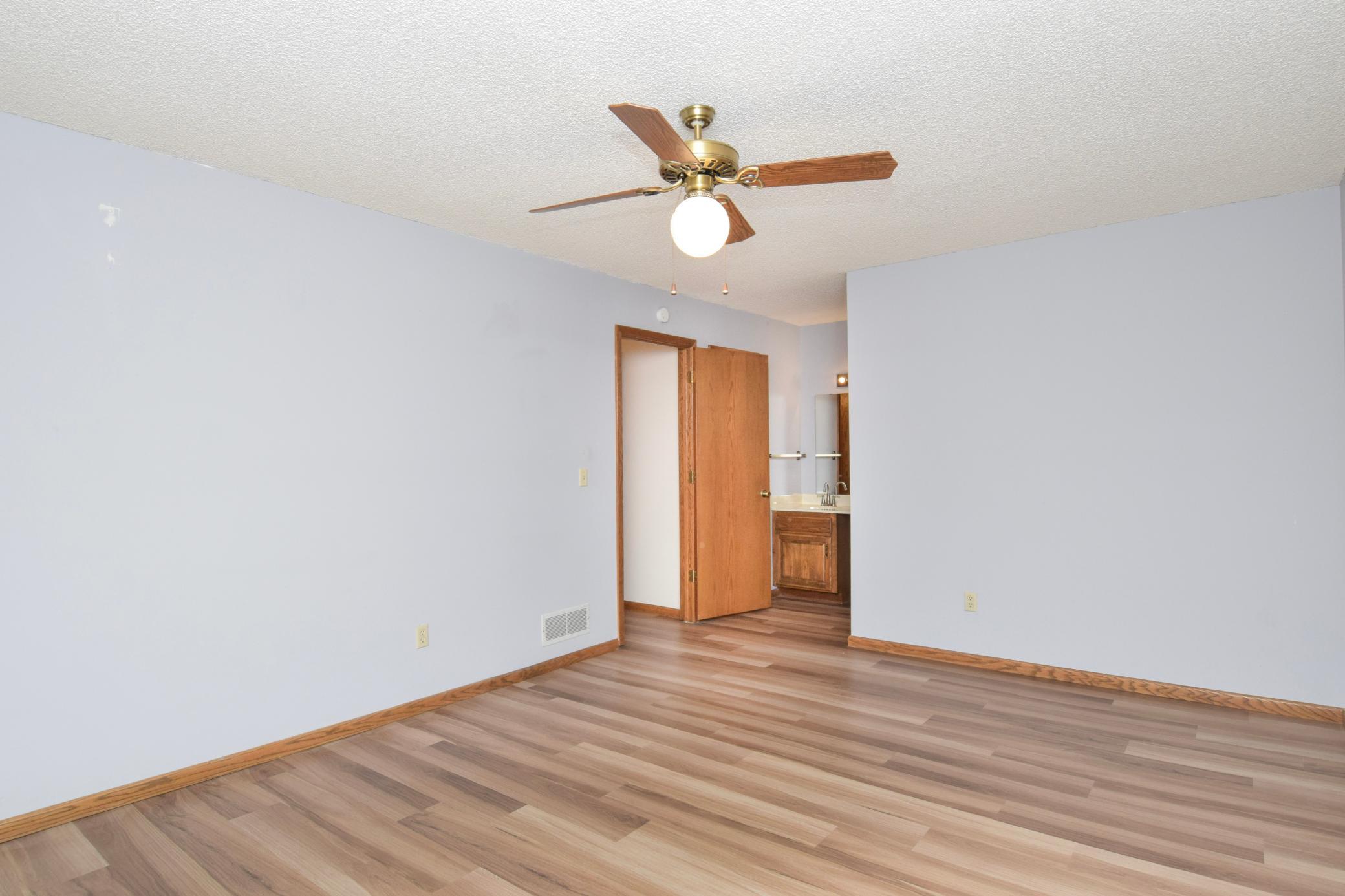Primary Bedroom with Walk-Thru to Bathroom and Added Vanity.