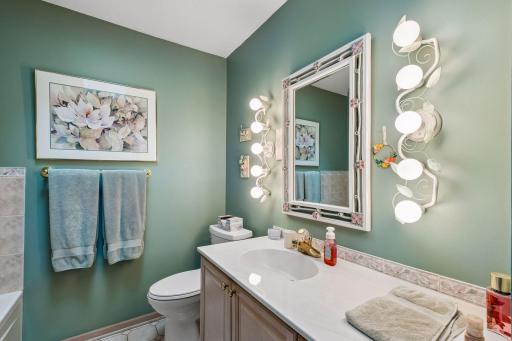 Second bathroom on upper level with jetted tub and sky light.