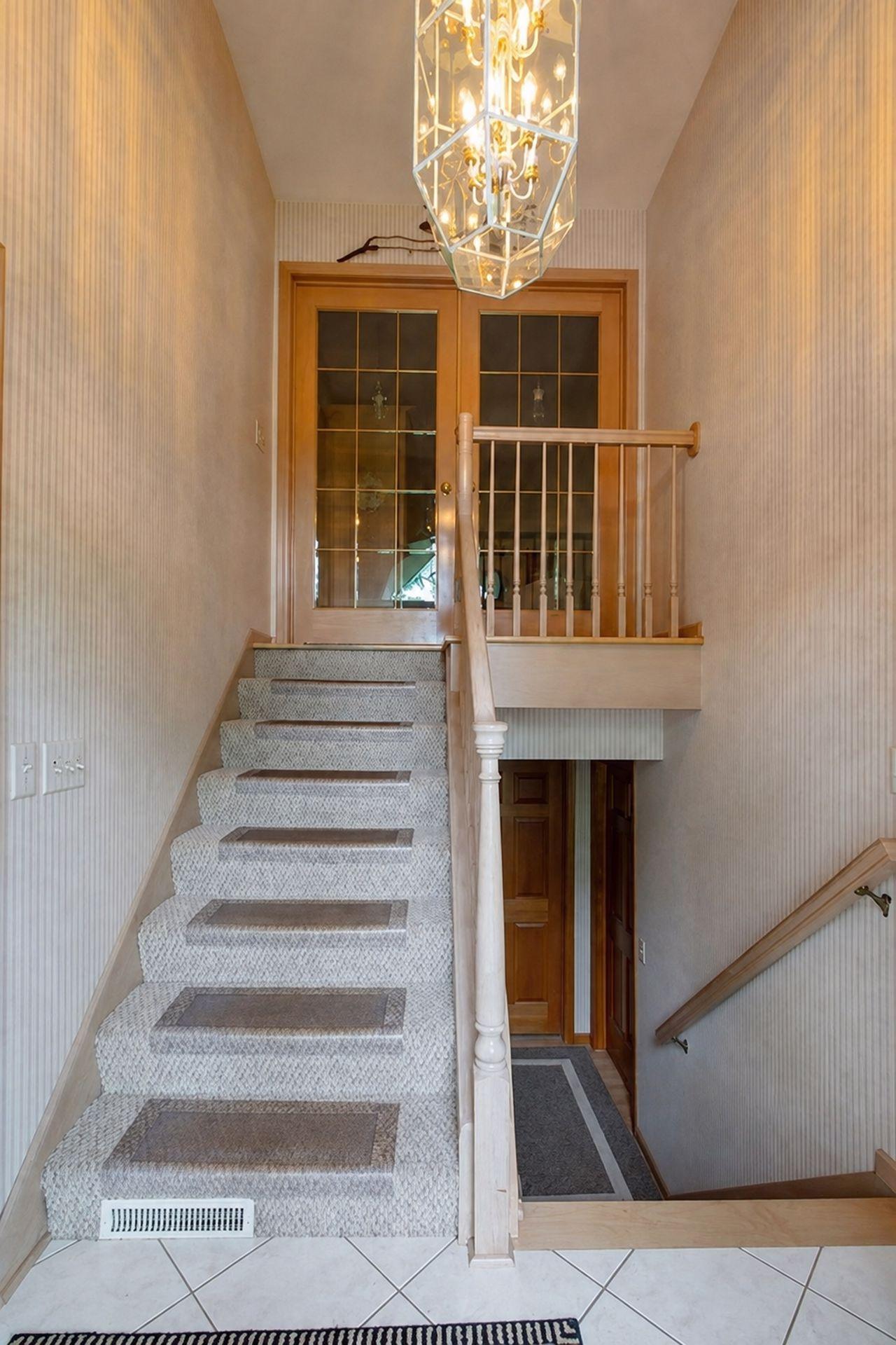 The split entrance to the upper and lower level with garage entrance just to the left.