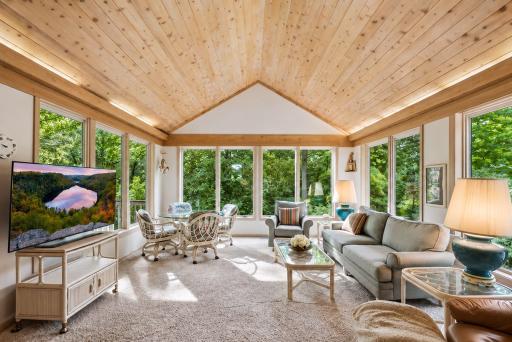 Upper level four season porch is the place to relax. Surrounded in privacy.