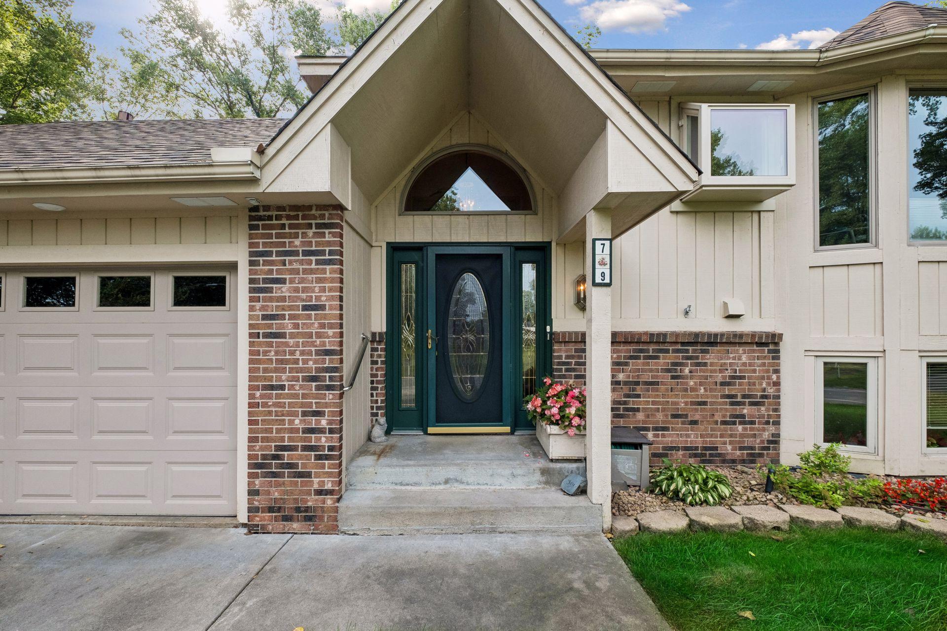 Shared front entryway. With shared foyer.