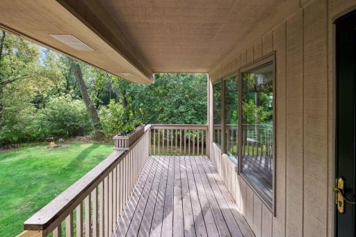 Upper level deck just off the four season porch. Notice fire pit in corner of yard.