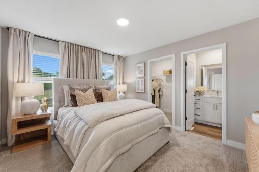 The ownerâs suite is a serene retreat featuring a large bedroom with an attached bathroom and walk-in closet.