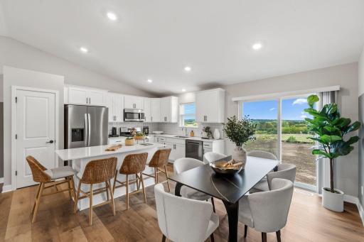 The dining area is perfectly placed near the kitchen for simple mealtime transitions.
