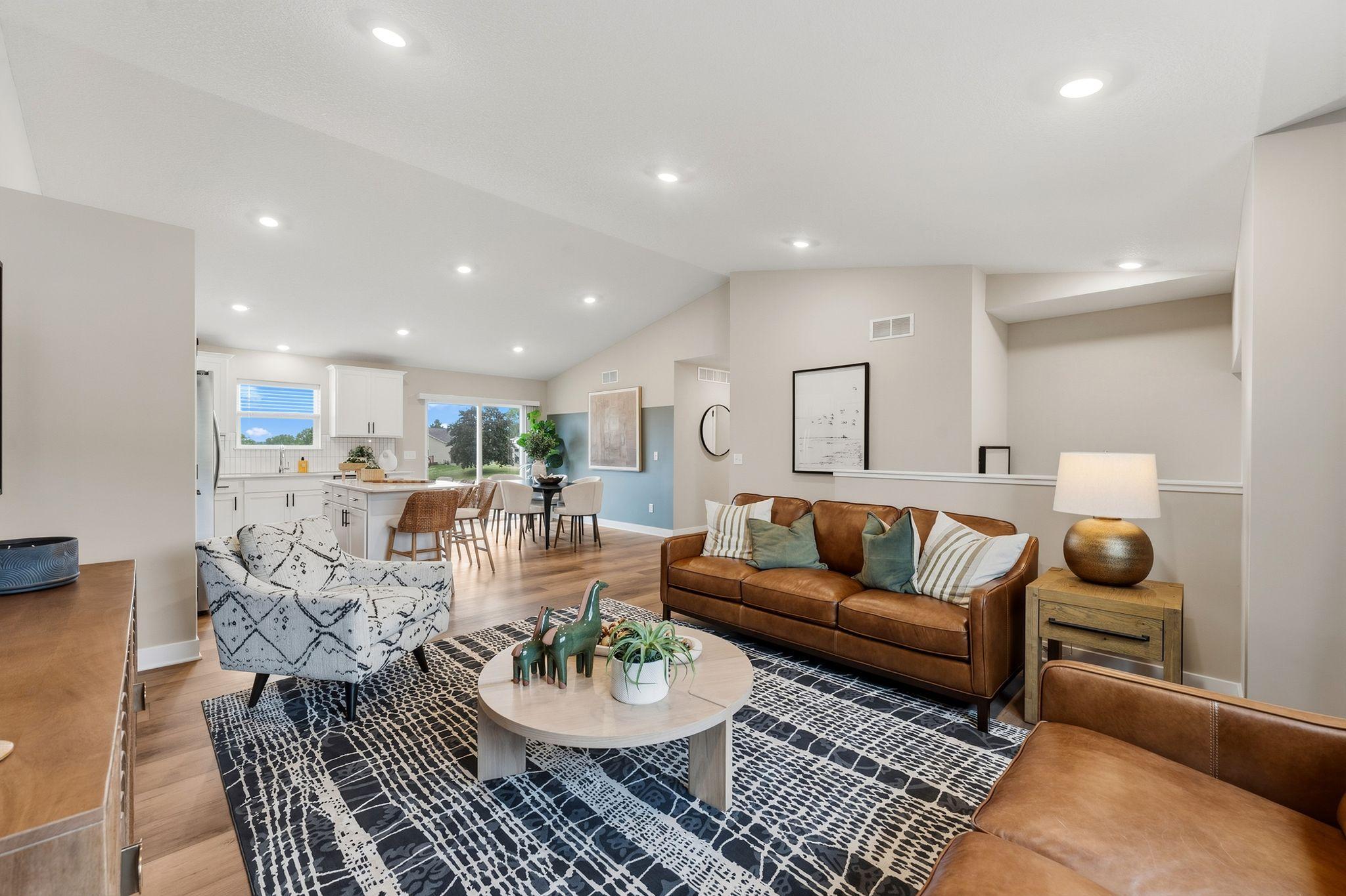 The living room is spacious and comfortable, ready for entertaining friends and family or relaxing while watching a favorite show.