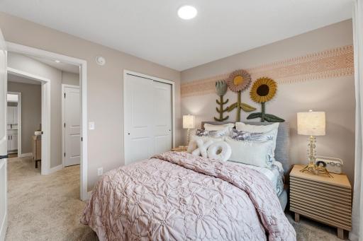 Two secondary bedrooms share a private hallway with the ownerâs suite.