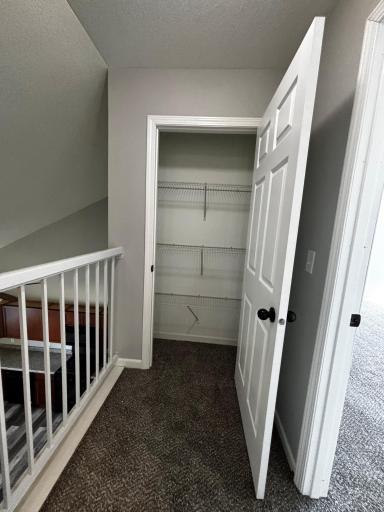 Upstairs linen closet outside primary bedroom