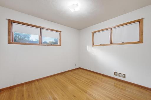Main floor features two bedrooms. This is the smaller of the two.