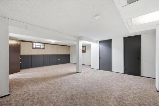 Great size recreational room for kids game space, movie night and walks out to the backyard.