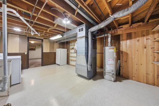 Nice and neat utility room with 2023 furnace and A/C