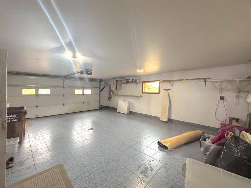 Spacious attached double garage offering plenty of room for vehicles, storage and additional space for tools, toys and lake gear.