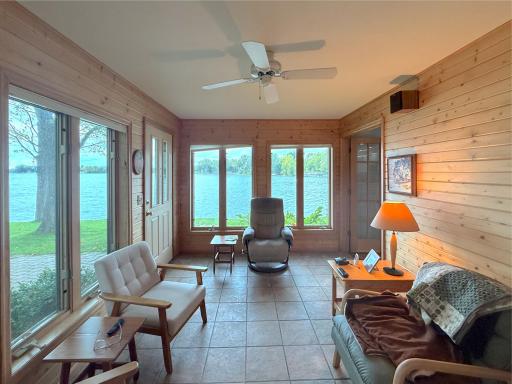Relax and take in the beautiful lake views from the three-season porch, surrounded by windows that bring the outdoors right into the space.