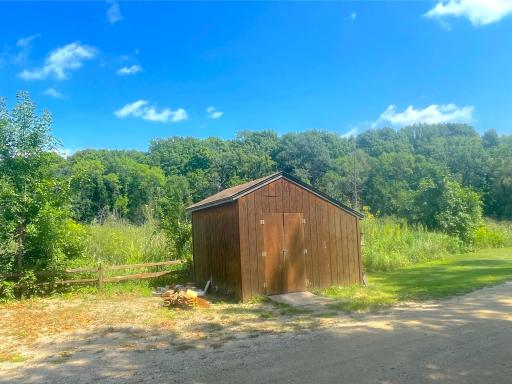 Roadside storage shed offers convenient additional space for lawn equipment, tools, lake gear and other outdoor essentials.