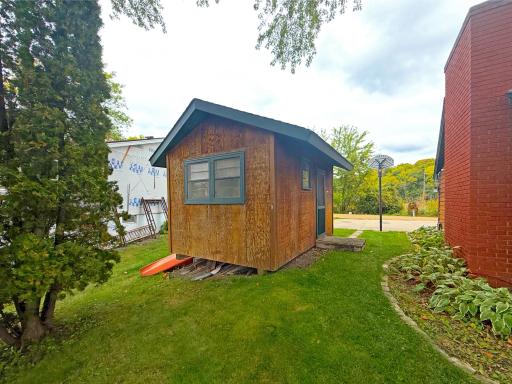 Convenient lakeside storage shed offering a great spot to keep water toys, fishing gear and other lake essentials close to the shore.