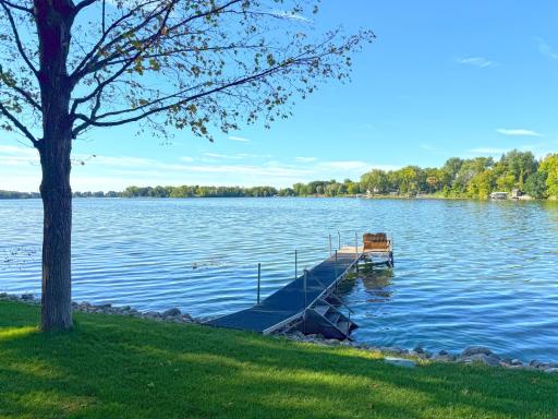 The level lot leads right to the waterâs edge, where a newly landscaped shoreline and southwest-facing views.