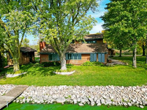 Enjoy lake living on beautiful Rock Lake with this three bedroom, two bath home offering 121 feet of lakeshore.