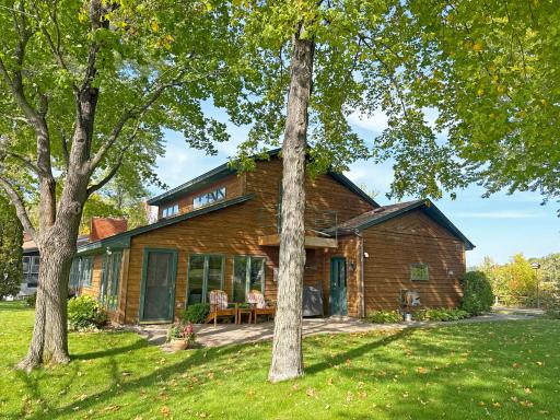 Mature trees provide welcome shade while still leaving plenty of open lawn for outdoor activities and gatherings.