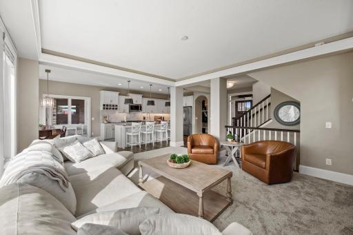 Crown Molding with Ambient Lighting around the perimeter of the Living Room
