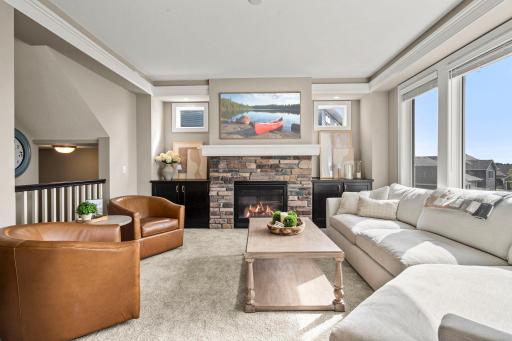 One of Three Gas Fireplaces flanked by beautiful Built-in Cabinetry