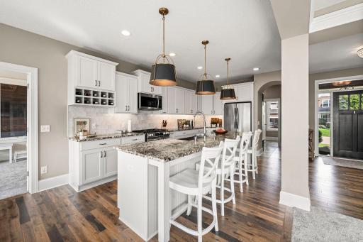 Stainless steel appliances complement the kitchenâs crisp, timeless finishes.