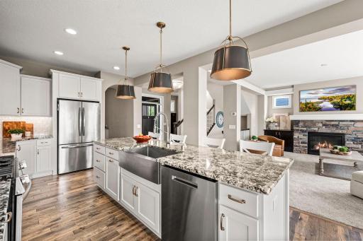 Generous center island provides additional prep space, storage, and casual gathering space.