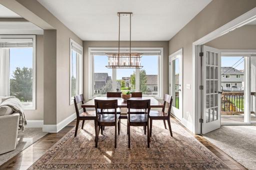 Informal dining area flows seamlessly between the kitchen and outdoor living space.