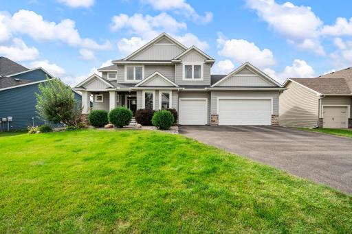 Attached three-car heated garage offers excellent parking, storage, and year-round functionality.
