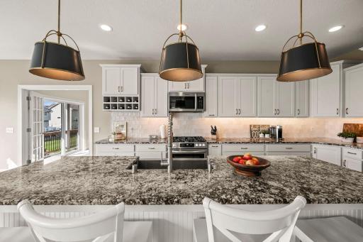 Recently updated zellige-style tile backsplash adds texture and character to the kitchen.