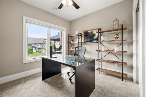 Private fifth bedroom provides flexible space for guests, hobbies, or a home office. Brand-new carpet continues into the lower-level fifth bedroom.