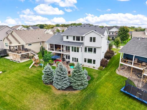Beautifully landscaped .23-acre homesite with mature pine trees framing the backyard.