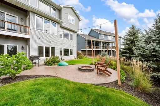 Walkout patio doors lead directly to the backyard and stamped-concrete patio.