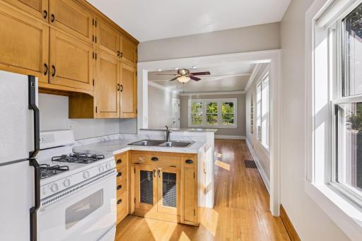 Kitchen features refrigerator, stove, and microwave
