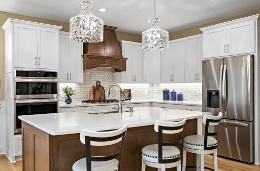 Kitchen with a mix of enamel and warm wood tones.